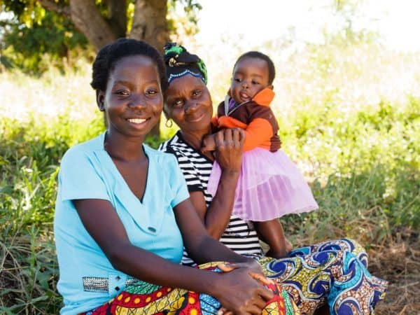 A fistula survivor with her mother and young daughter.
